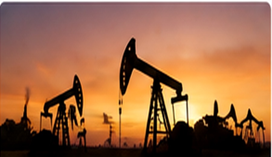 Oil field pumpjacks at sunset